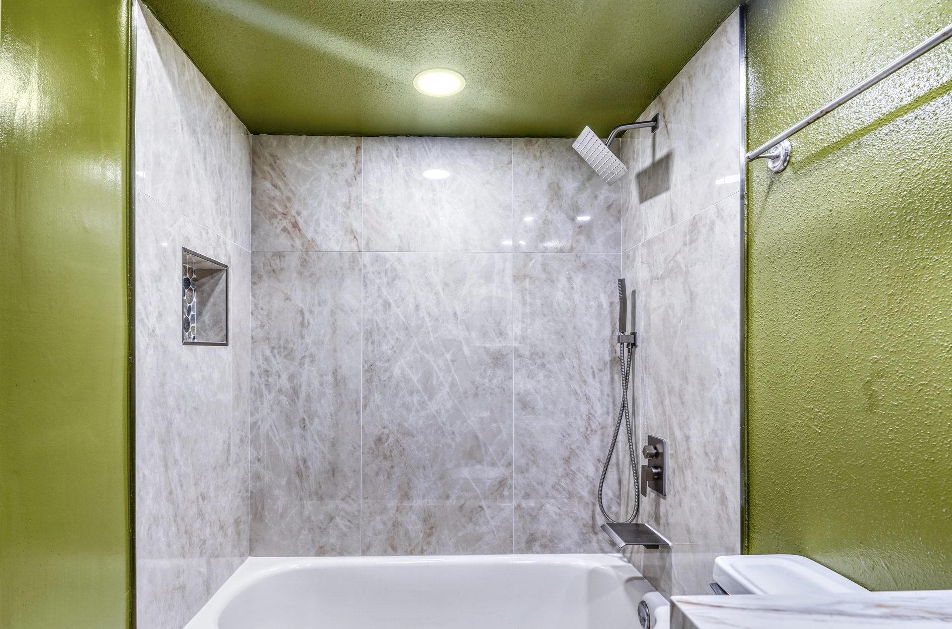 Luxury bathroom renovation in Houston TX - marble walk-in shower with glass enclosure