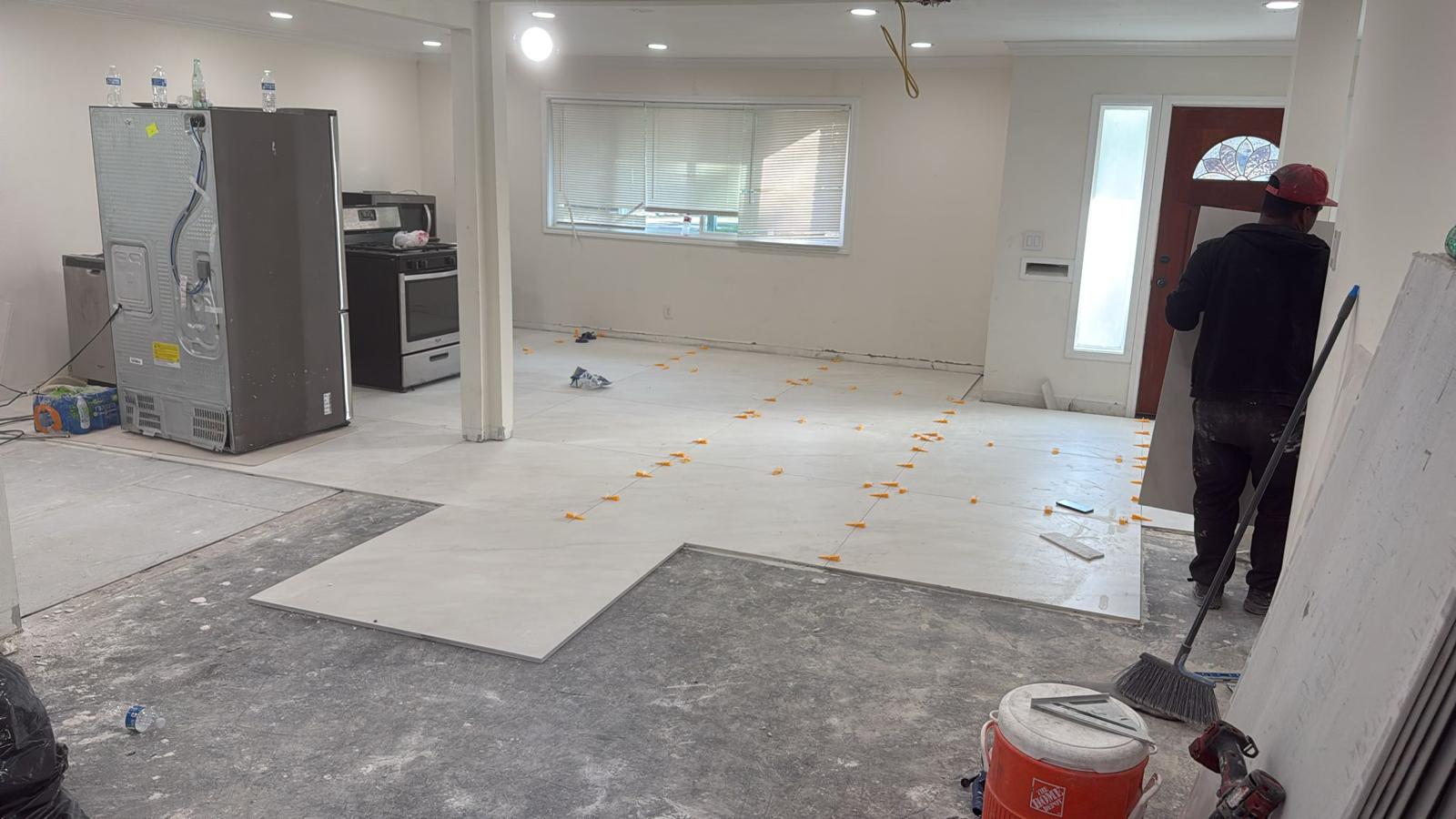 Large Format Tile Installation in Progress with Leveling Spacers - Houston Flooring Contractor