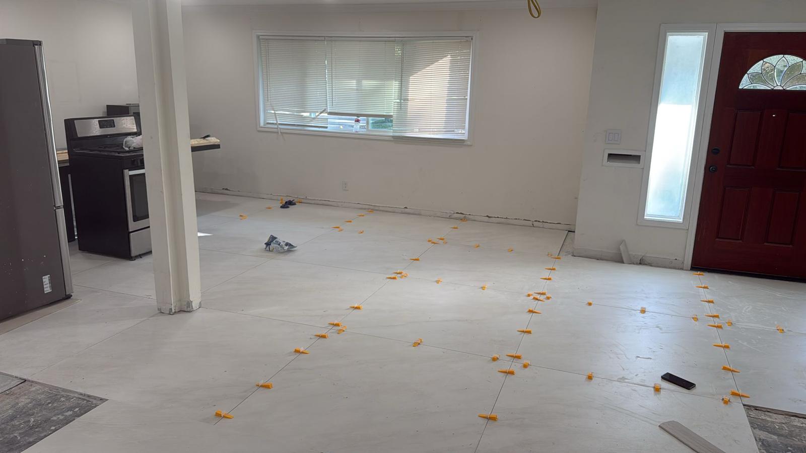 Tile Flooring Installation with Precision Spacers in Living Room - Houston TX Home Renovation